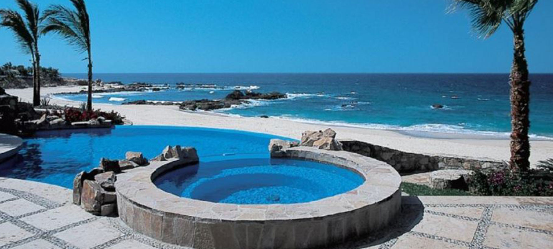 Coastal pool and beach at a premier resort property